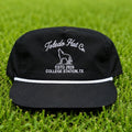 Toledo Hat Co. Black and White Coyote Hat – front view, structured snapback with braided rope brim detail