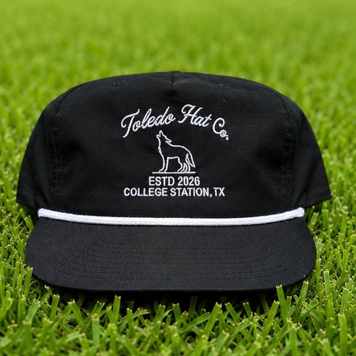 Toledo Hat Co. Black and White Coyote Hat – front view, structured snapback with braided rope brim detail