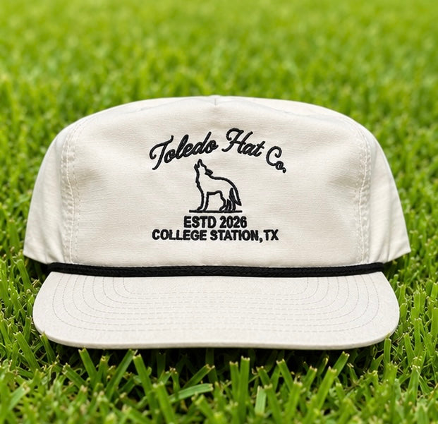 Toledo Hat Co. White and Black Coyote Hat – front view, structured snapback with braided rope brim detail