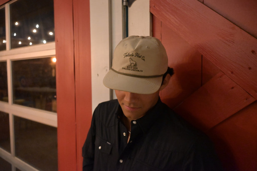 Toledo Hat Co. Sand Dune and Loden Coyote Hat – lifestyle shot outdoors
